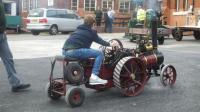Callam, one of our younger members takes the traction engine for a spin past the Listers   [DSCF0046a.JPG uploaded 20 Oct 2015]